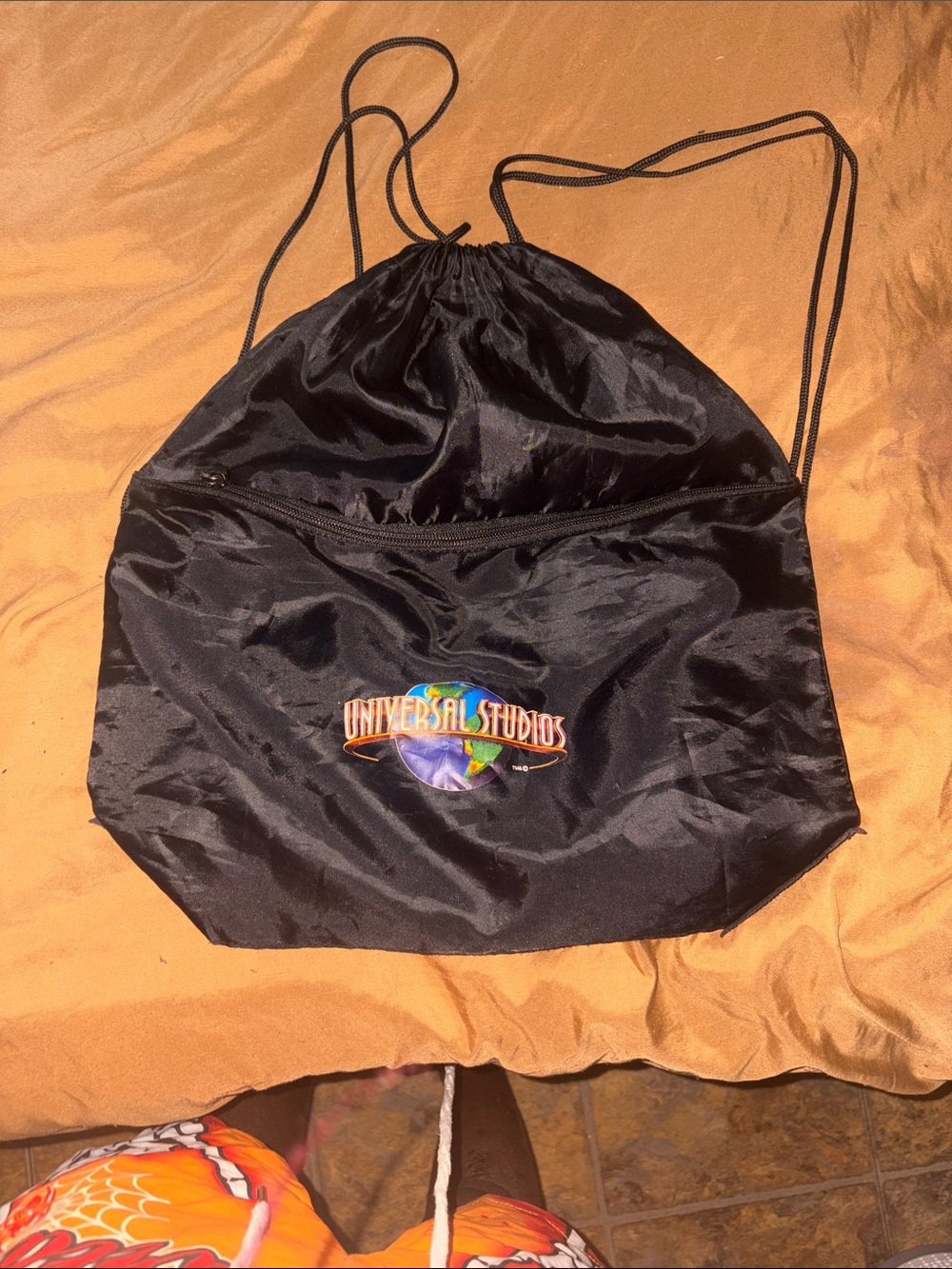 Universal Black Drawstring Backpack with Multicolor Logo